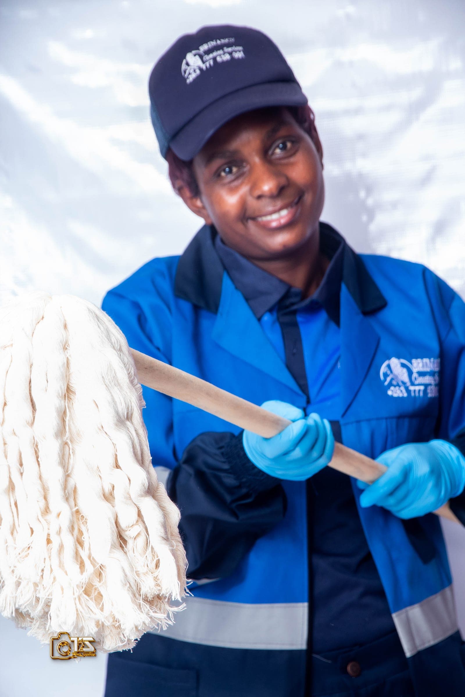 Brinancy cleaner holding a professional mop head